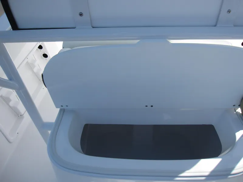 Slide: The Image of 2023 Clearwater 2300 boat storage compartment with open lid. - 24