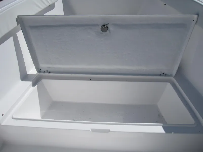 Slide: The Image of Open storage compartment on a 2023 Clearwater 2300 boat. - 9