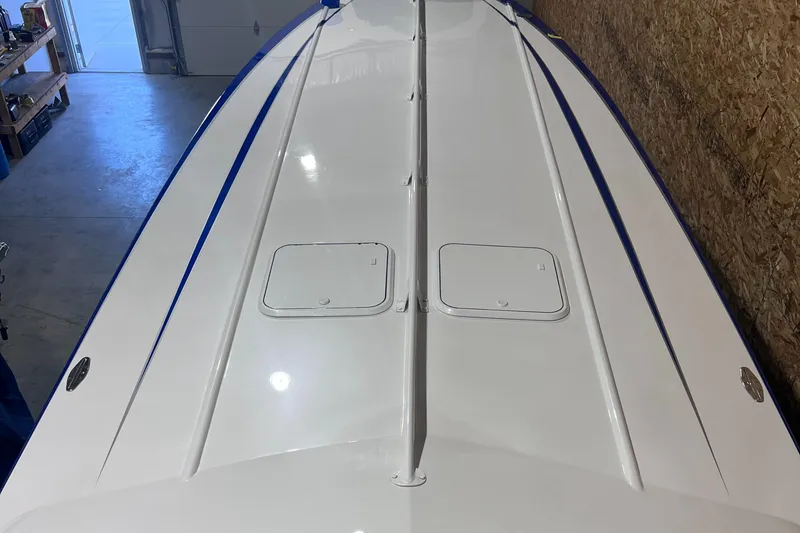 Slide: The Image of 1994 Apache 41 boat in a garage, top view. - 1