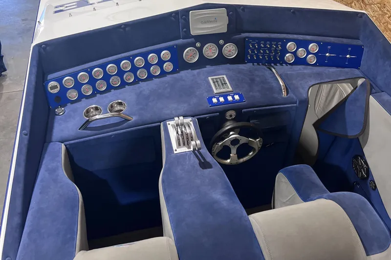 Slide: The Image of 1994 Apache 41 boat dashboard with blue and white interior, multiple gauges, and controls. - 2