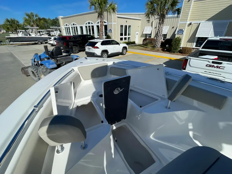 Slide: The Image of 2024 Key West 239 FS boat interior with seating and storage compartments. - 13