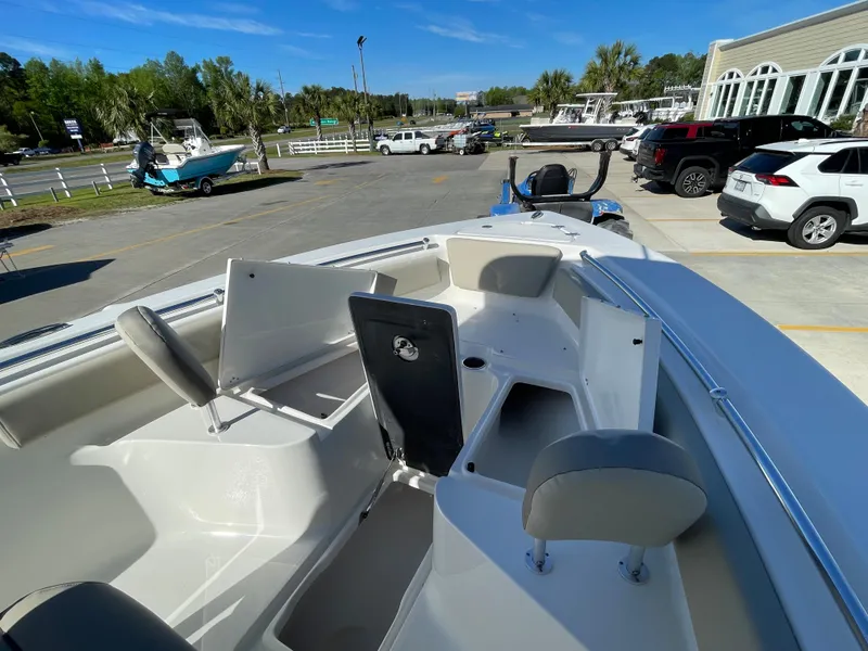Slide: The Image of 2024 Key West 239 FS boat interior with open storage compartments. - 14