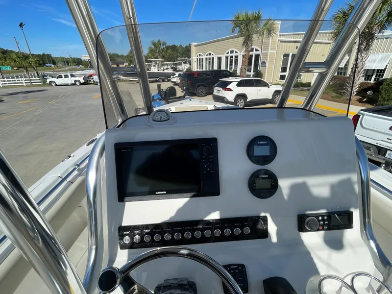 Slide: The Image of 2024 Key West 239 FS boat console with navigation system and controls. - 19