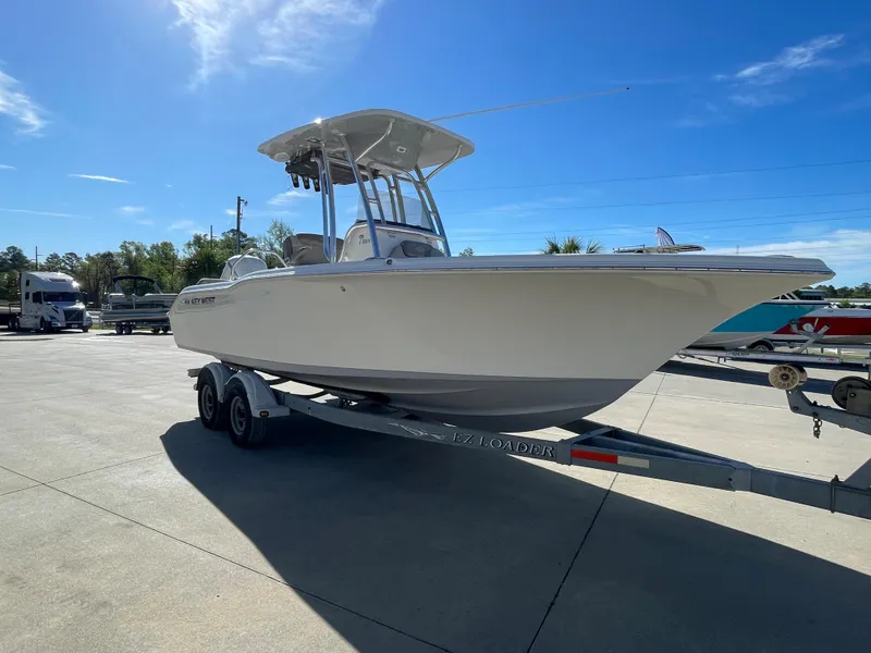 Slide: The Image of 2024 Key West 239 FS boat on trailer in outdoor lot. - 2