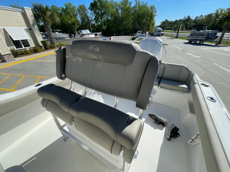 Slide: The Image of 2024 Key West 239 FS boat interior with cushioned seating and console. - 9
