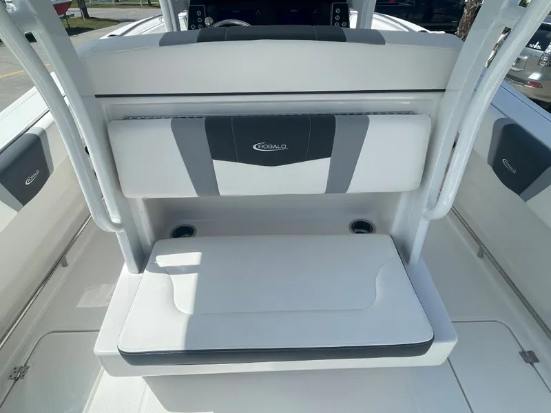Slide: The Image of 2023 Robalo 270 boat seating area with cup holders. - 10