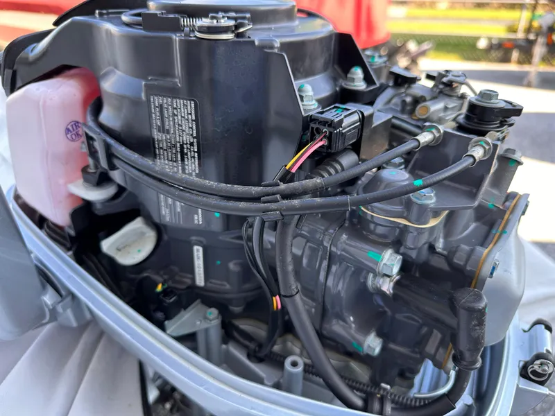 Slide: The Image of Close-up of a 2020 Bris 10' Ribbed boat engine components. - 2