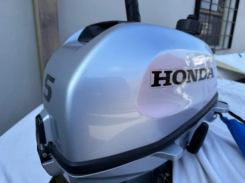 Slide: The Image of Honda 5HP outboard motor on a 2020 Bris 10' Ribbed boat. - 3