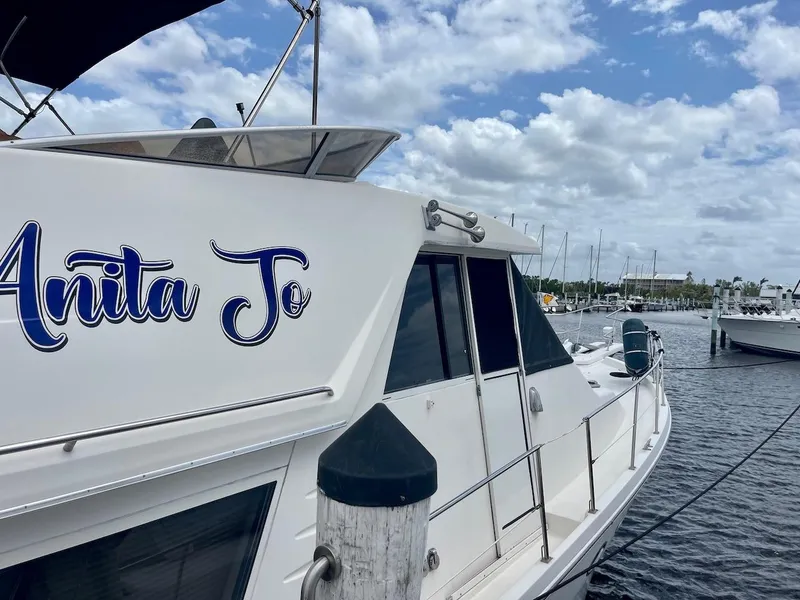 Slide: The Image of 2004 Meridian 490 Pilothouse yacht docked under cloudy sky. - 10