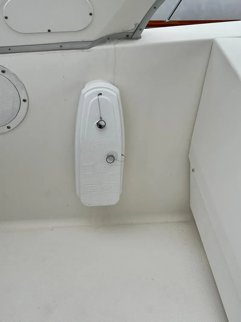 Slide: The Image of 2004 Meridian 490 Pilothouse boat interior with white panel and latch. - 15