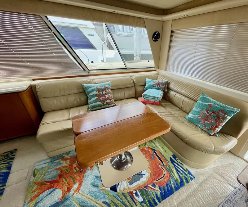 Slide: The Image of Luxurious 2004 Meridian 490 Pilothouse interior with leather seating and nautical decor. - 27