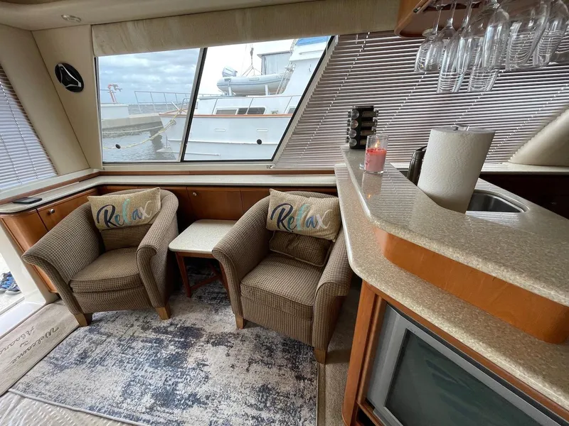 Slide: The Image of Luxurious 2004 Meridian 490 Pilothouse interior with cozy seating and elegant decor. - 28