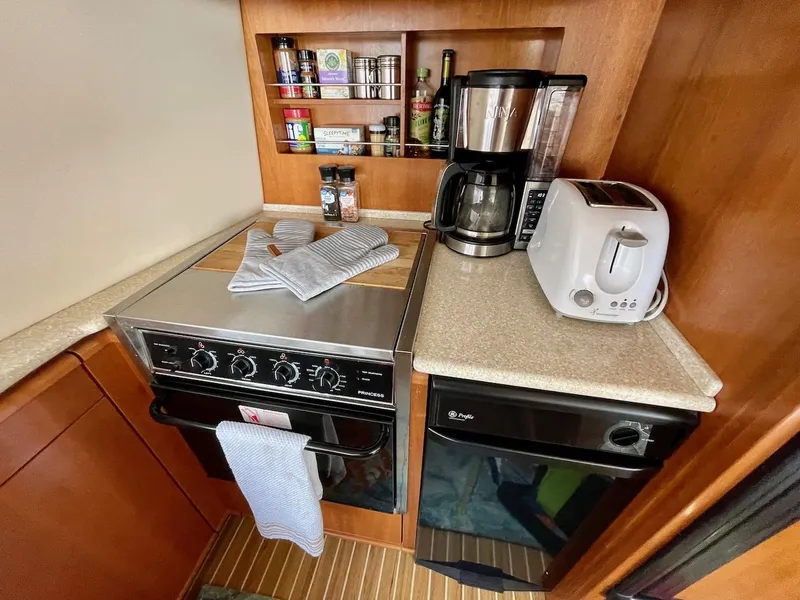 Slide: The Image of Compact kitchen in 2004 Meridian 490 Pilothouse with stove, coffee maker, and toaster. - 34