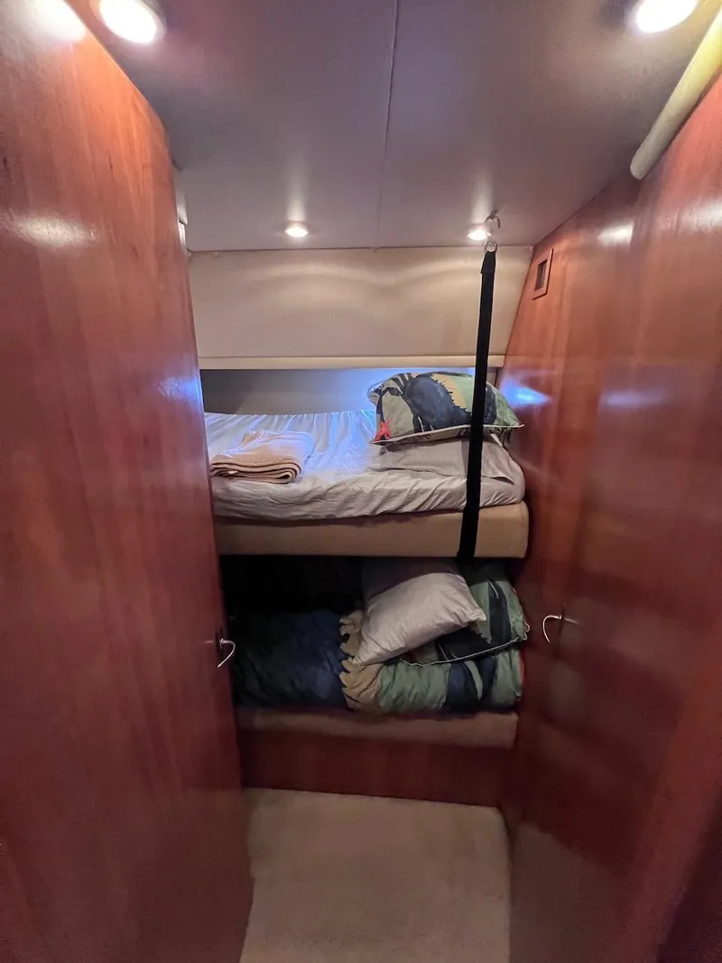 Slide: The Image of Bunk beds in 2004 Meridian 490 Pilothouse cabin with wooden interior. - 40