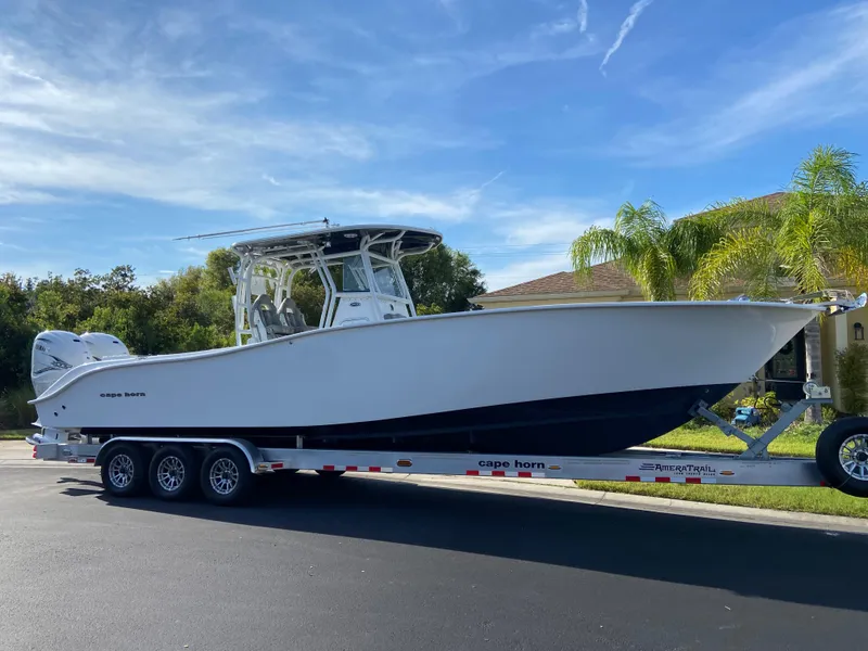 The Image of 2022 Cape Horn 34 XS boat on a trailer, parked outdoors. - 0