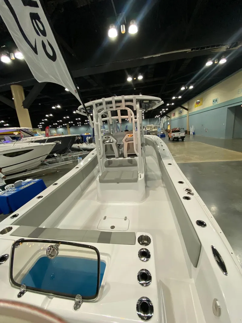 Slide: The Image of 2022 Cape Horn 34 XS boat displayed at an indoor exhibition. - 13