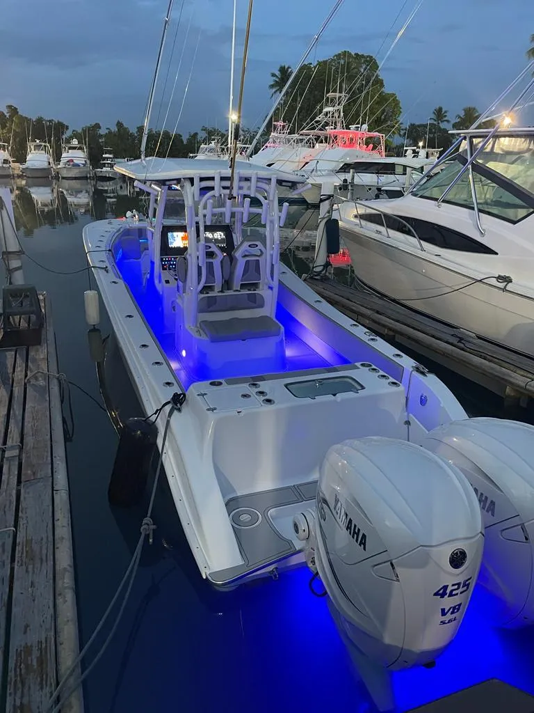 Slide: The Image of 2022 Cape Horn 34 XS boat with blue LED lights docked at marina. - 3