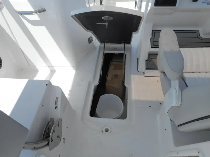 Slide: The Image of 2023 Sea Fox 268 Traveler boat interior with open storage compartment. - 12