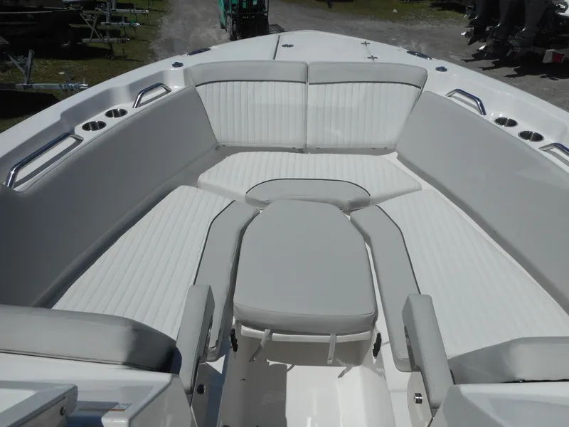 Slide: The Image of 2023 Sea Fox 268 Traveler boat interior with cushioned seating and stainless steel cup holders. - 15
