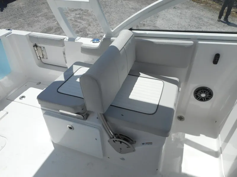 Slide: The Image of 2023 Sea Fox 268 Traveler boat seating area with white and gray upholstery. - 18