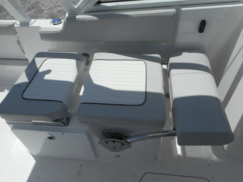 Slide: The Image of 2023 Sea Fox 268 Traveler boat seating area with white cushioned seats. - 19