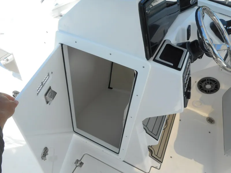 Slide: The Image of 2023 Sea Fox 268 Traveler boat storage compartment near the helm. - 22