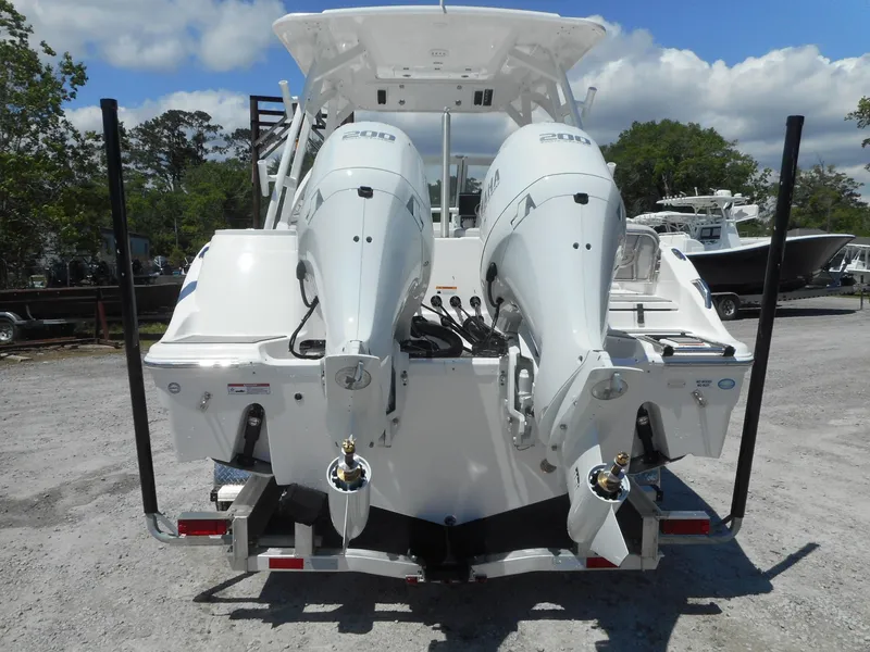 Slide: The Image of 2023 Sea Fox 268 Traveler boat with dual outboard engines, rear view. - 4
