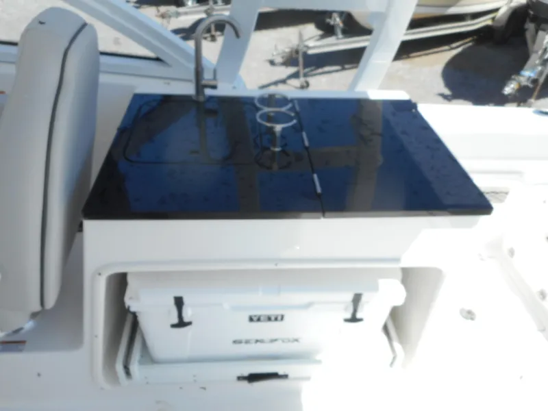 Slide: The Image of 2023 Sea Fox 268 Traveler boat with a built-in sink and cooler. - 8