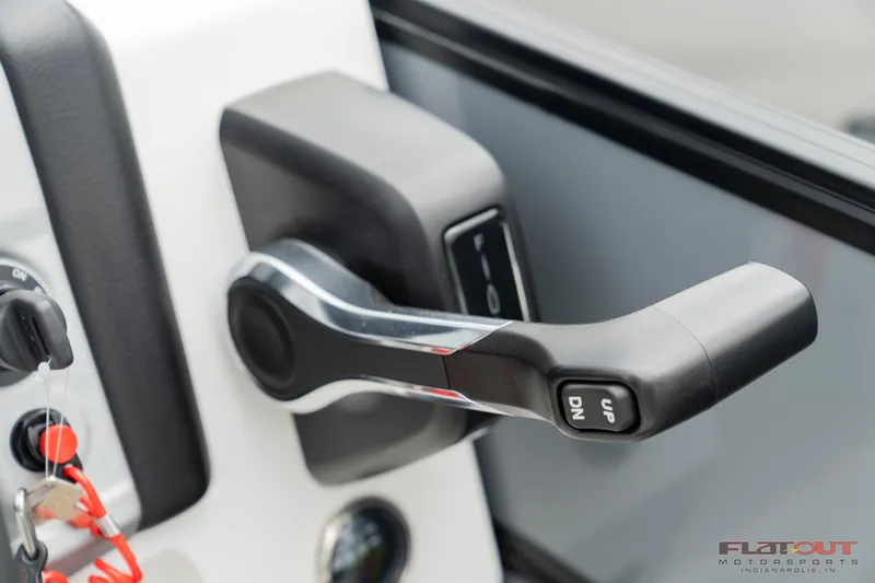 Slide: The Image of Close-up of 2023 South Bay S224 Universal Lounge 200HP throttle control. - 11