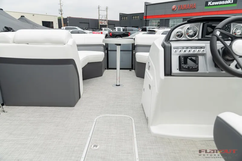 Slide: The Image of 2023 South Bay S224 Universal Lounge 200HP interior, showcasing seating and control panel. - 13