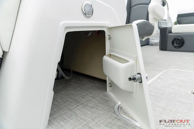 Slide: The Image of Open storage compartment in 2023 South Bay S224 Universal Lounge 200HP boat. - 15