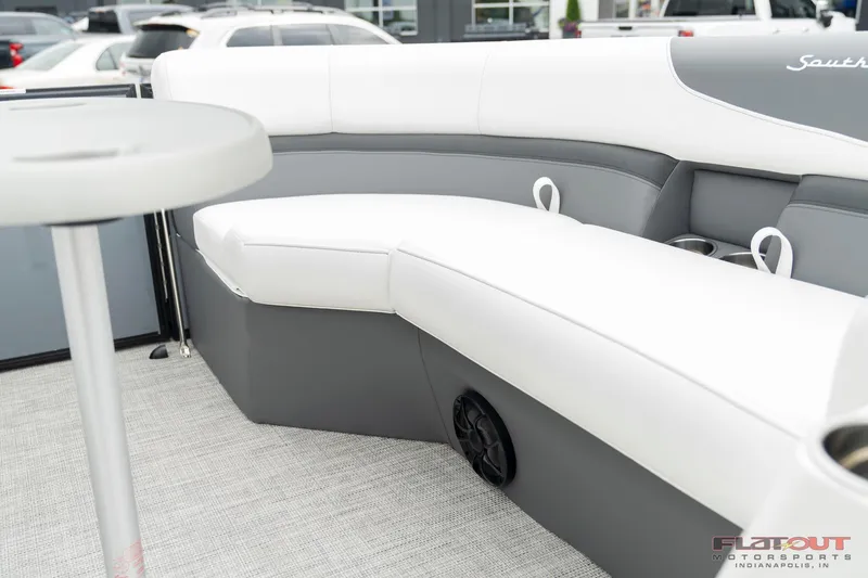 Slide: The Image of 2023 South Bay S224 Universal Lounge 200HP interior seating area with table. - 16