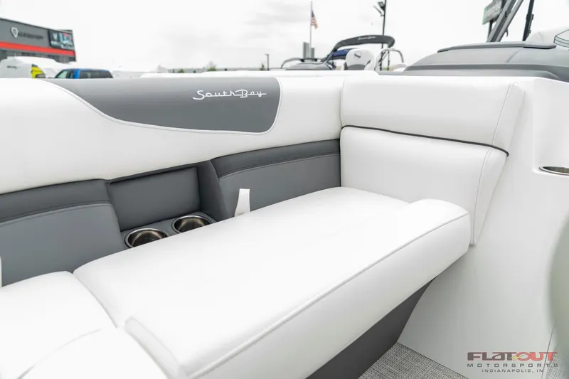 Slide: The Image of 2023 South Bay S224 Universal Lounge 200HP interior seating with cup holders. - 18