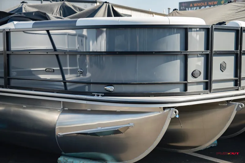 Slide: The Image of 2023 South Bay S224 Universal Lounge 200HP pontoon boat in a showroom. - 26