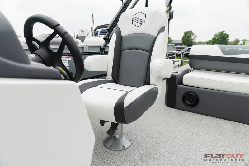 Slide: The Image of 2023 South Bay S224 Universal Lounge 200HP boat interior with captain's chair and lounge seating. - 5