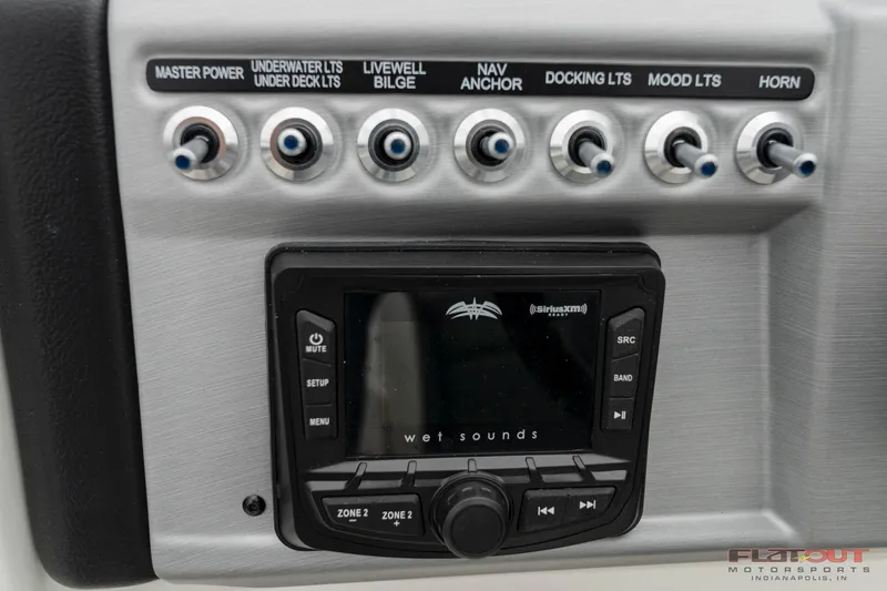Slide: The Image of Control panel of 2023 South Bay S224 Universal Lounge 200HP boat with Wet Sounds audio system. - 7