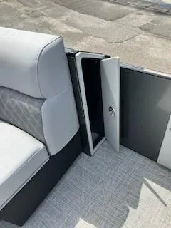 Slide: The Image of 2023 Vanderbilt 700T boat interior with open storage compartment. - 14