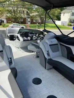 Slide: The Image of 2023 Vanderbilt 700T boat interior with modern seating and steering console. - 18