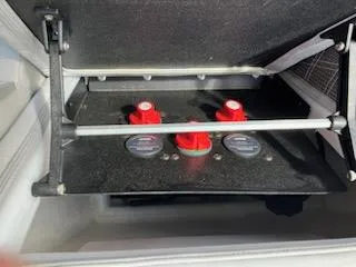 Slide: The Image of Battery compartment of a 2023 Vanderbilt 700T with red switches and gauges. - 20