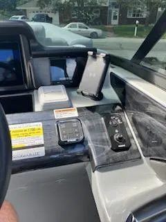 Slide: The Image of Control panel of a 2023 Vanderbilt 700T boat with modern navigation equipment. - 21