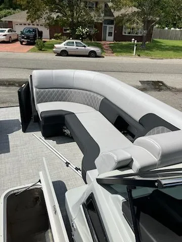 Slide: The Image of 2023 Vanderbilt 700T boat with spacious, luxurious seating on a residential street. - 5