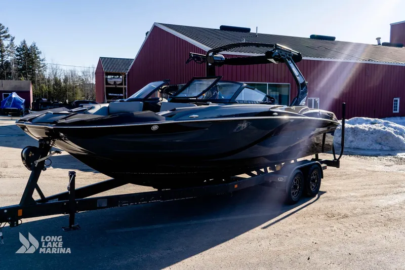 Slide: The Image of 2022 Centurion Fi23 boat on trailer at Long Lake Marina, sunny day. - 4