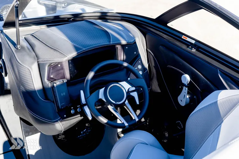 Slide: The Image of 2022 Centurion Fi23 boat interior with modern steering wheel and dashboard controls. - 5