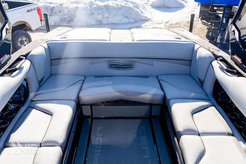 Slide: The Image of 2022 Centurion Fi23 boat interior with luxurious gray seating and spacious layout. - 6