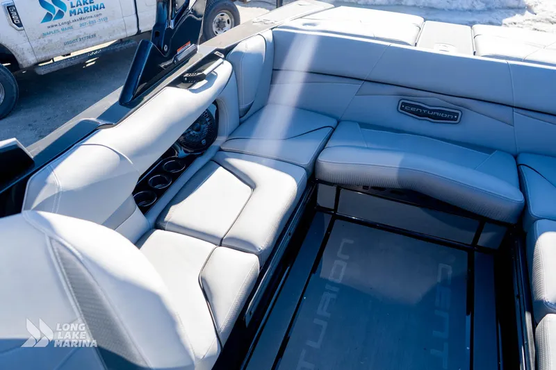 Slide: The Image of 2022 Centurion Fi23 boat interior with luxurious seating and sleek design. - 7