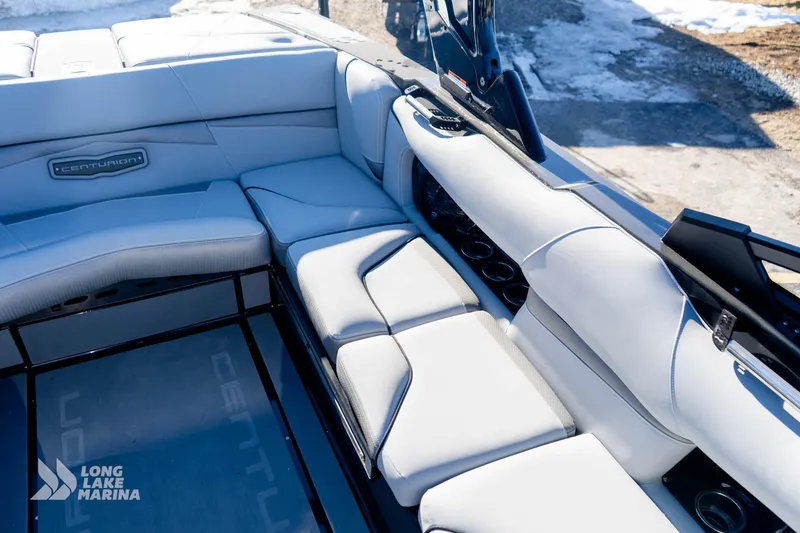 Slide: The Image of 2022 Centurion Fi23 boat interior with luxurious seating and cup holders, Long Lake Marina. - 8