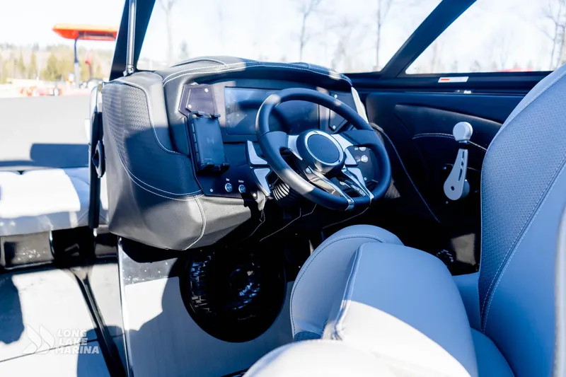 Slide: The Image of 2022 Centurion Fi23 boat interior with modern steering wheel and dashboard controls. - 9
