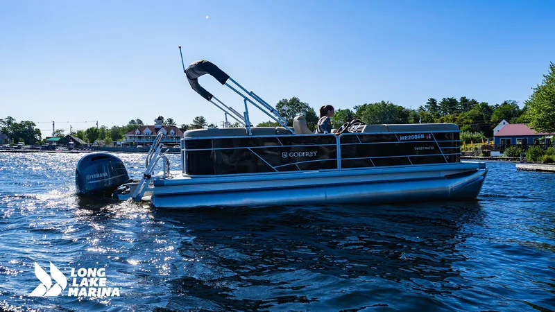 Slide: The Image of 2023 Godfrey Sw2286SB pontoon boat on a sunny lake at Long Lake Marina. - 11