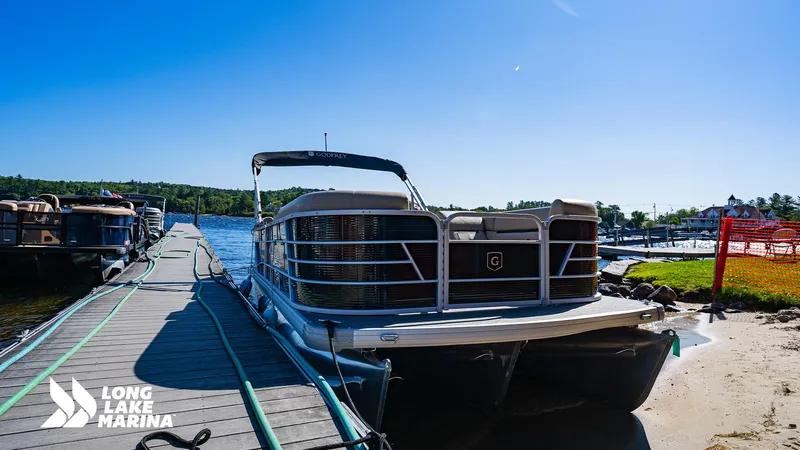Slide: The Image of 2023 Godfrey Sw2286SB pontoon boat docked at Long Lake Marina under clear blue sky. - 7