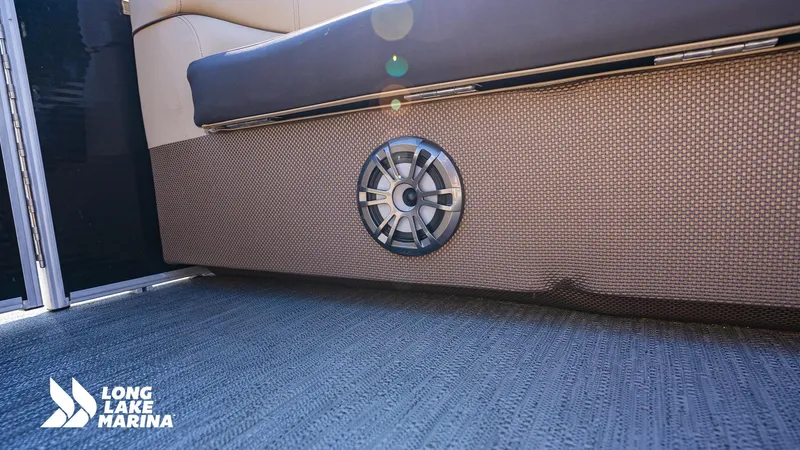 Slide: The Image of 2023 Godfrey Sw2286SB boat interior with speaker, Long Lake Marina branding. - 8